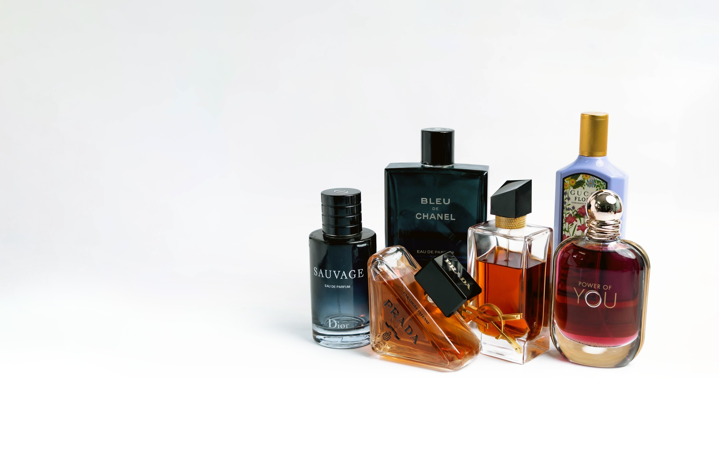 Sauvage, Bleu de Chanel, Prada, YSL, and Gucci Flora decants, grouped together